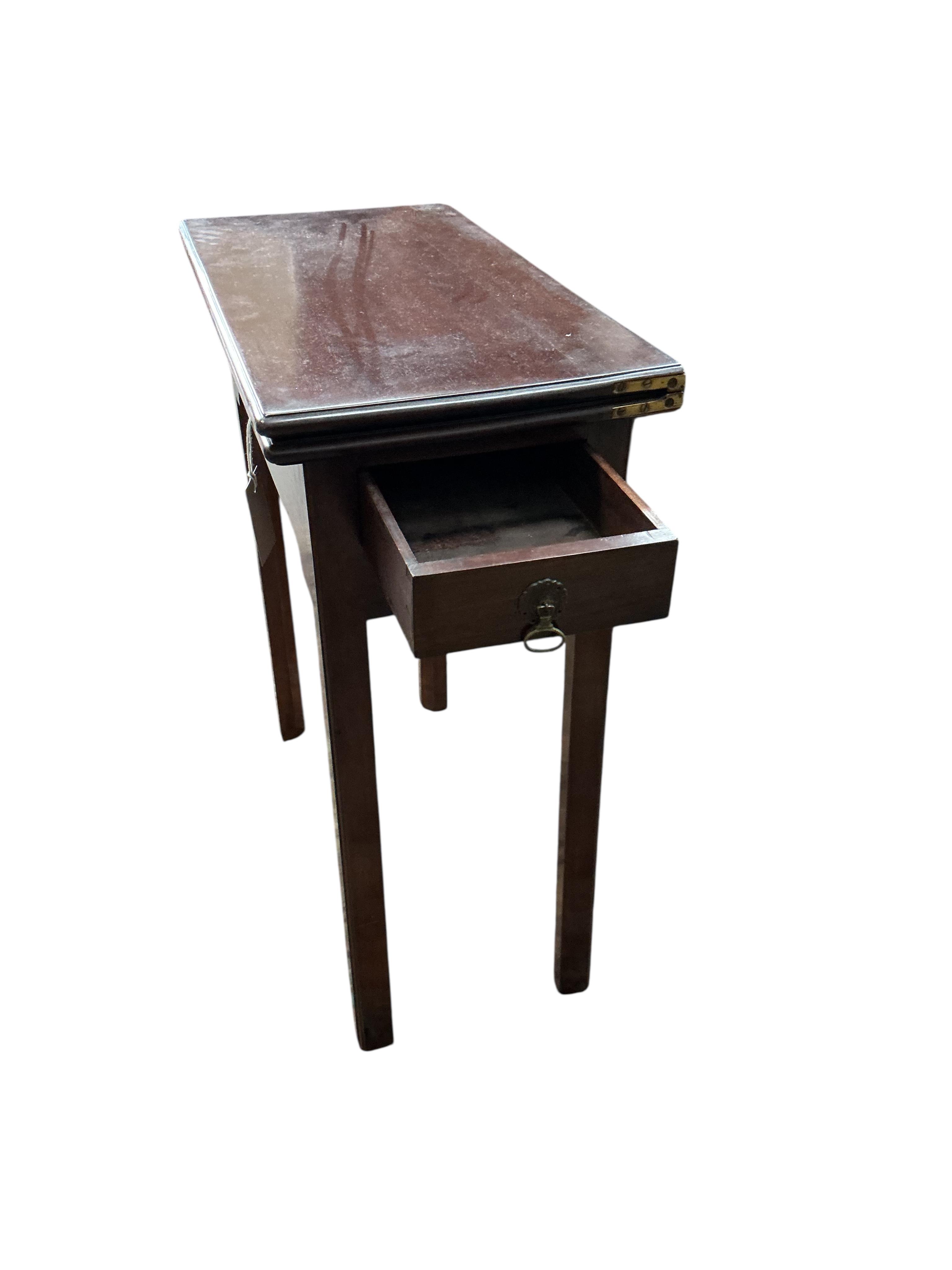 A George II rectangular mahogany folding tea table, width 63cm, depth 32cm, height 72cm